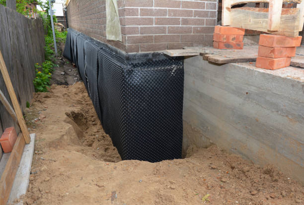 Happy homeowners after waterproofing job in Milwaukee
